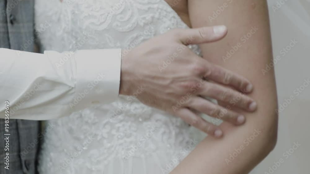 Young loving couple holding hands, hugging and kissing Young loving couple holding hands, hugging and kissing