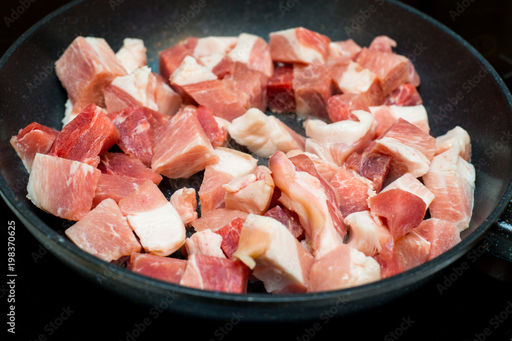 Red meat on a frying pan Red meat on a frying pan