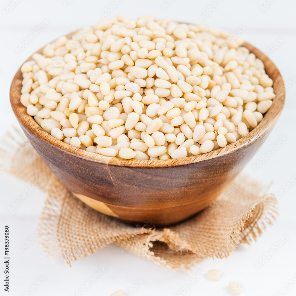 Shelled Raw Pine Nuts in the Wooden Bowl