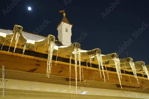 Photography Icicles hanging from the roof at night in Moscow