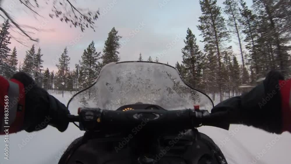 POV shot riding a snow mobil