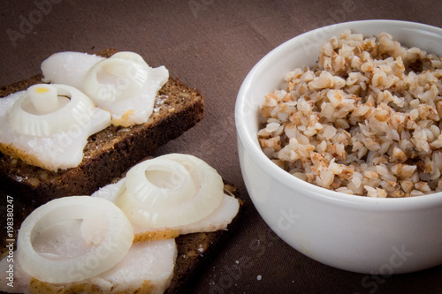 boiled buckwheat and bread with bacon and onions