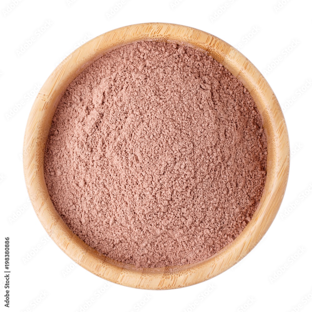 Cocoa powder in a wooden bowl isolated on white. Top view. Cocoa powder in a wooden bowl isolated on white. Top view.