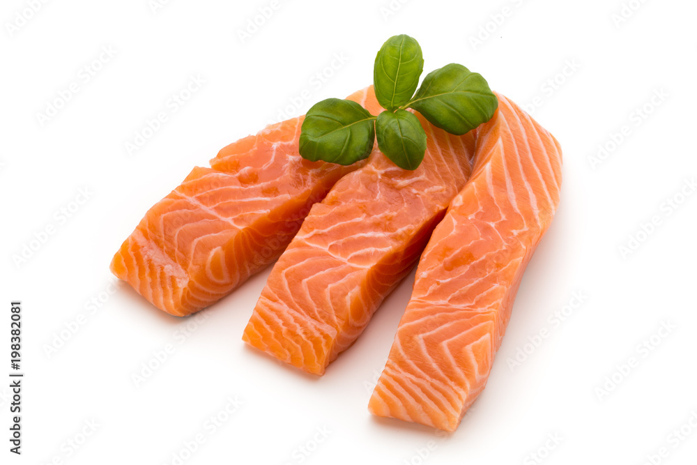 Fresh salmon fillet with basil on the white background. Fresh salmon fillet with basil on the white background.