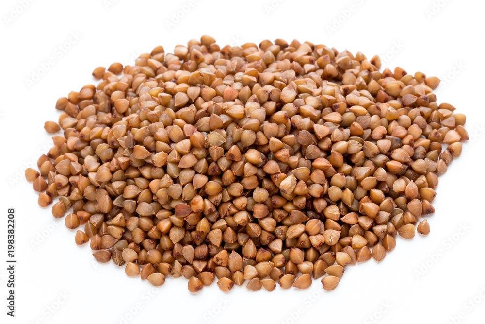 Buckwheat grains isolated on the white background. Buckwheat grains isolated on the white background.