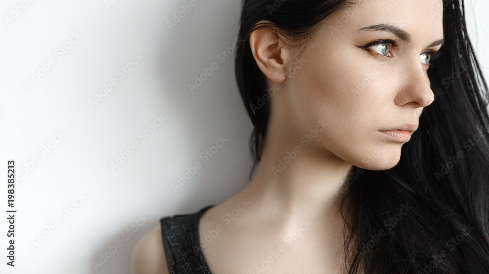 Portrait of brunette girl looks in the side Portrait of brunette girl looks in the side