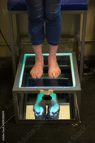 Step Digital Foot Scan, Orthotics Foot Scan for Custom Made Shoe Insoles, Posture and equilibrium analysis. Doctor, patient. Posture and equilibrium analysis. Growth, balance. photo