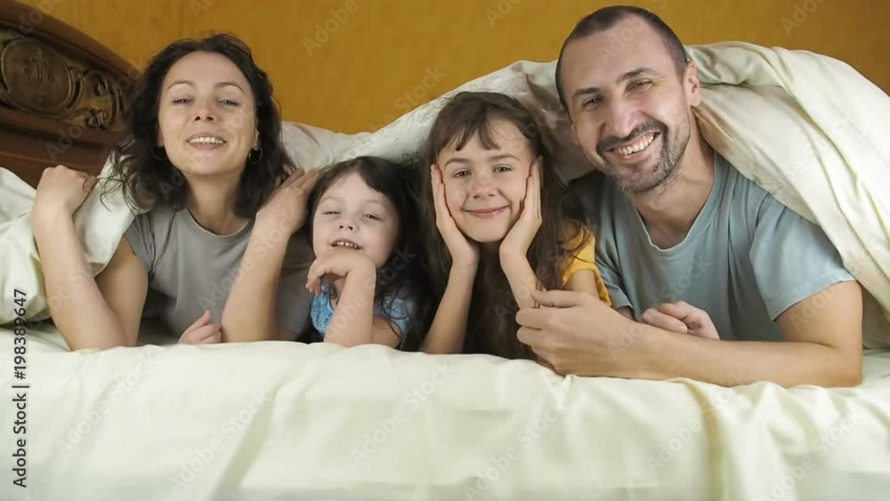 Happy family under the blanket. Happy family under the blanket.