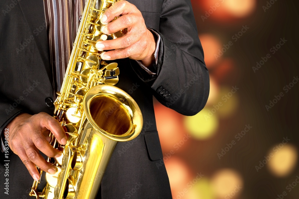 Obraz premium Ьan playing on saxophone