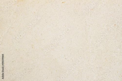Texture of light ecological cream paper, background for design with copy space text or image. Recyclable material, has small inclusions of cellulose