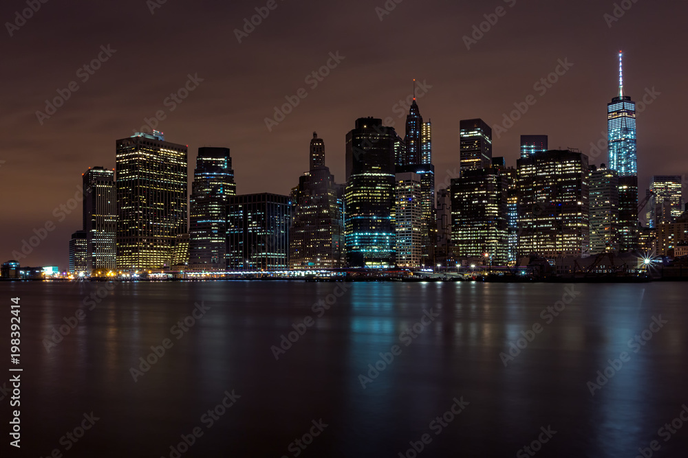 Downtown Manhattan night view from Brooklyn Bridge park