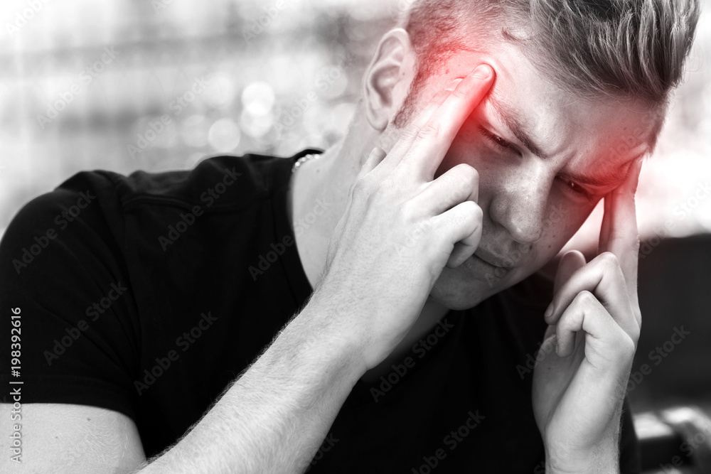 Portrait of a pretty man stress and headache having migraine pain Portrait of a pretty man stress and headache having migraine pain