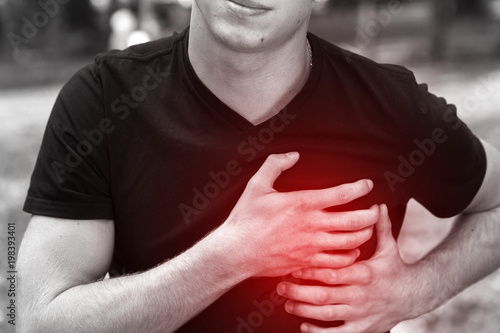 Outdoor portrait of a  man  with heart attack or broken heart