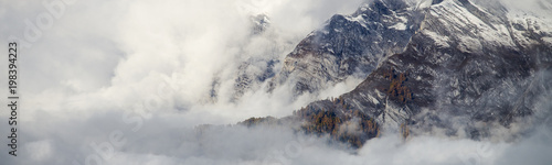 Aerial image of beautiful mountain landscape with clouds in the Valais Kanton