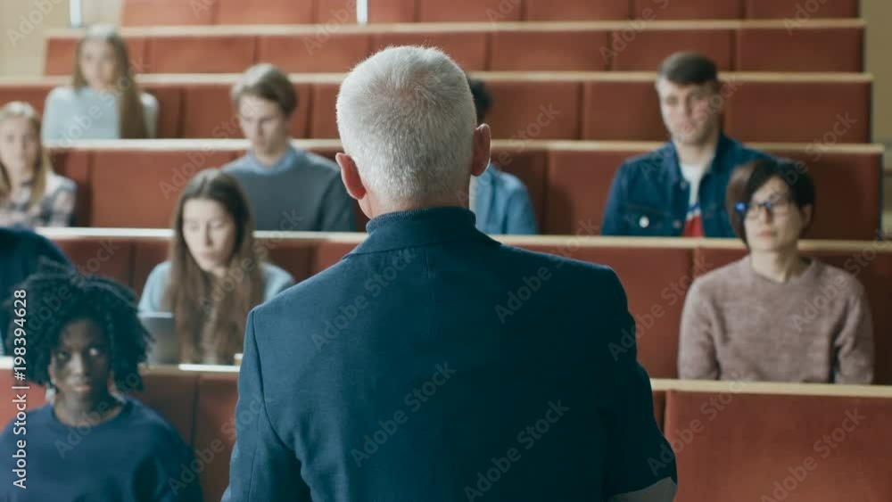 Camera Facing Class: Prominent Professor Writing on the Blackboard and ...