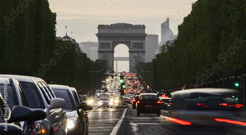 Long exposure photo of street traffic near Arc de Triomphe, Champs Elysees boulevard. Paris, France © Ioan Panaite