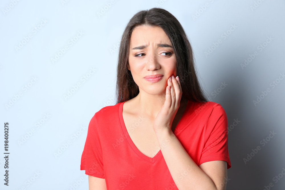 Woman with sensitive teeth on color background Woman with sensitive teeth on color background