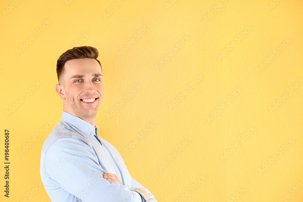 Portrait of young man with beautiful hair on color background Portrait of young man with beautiful hair on color background