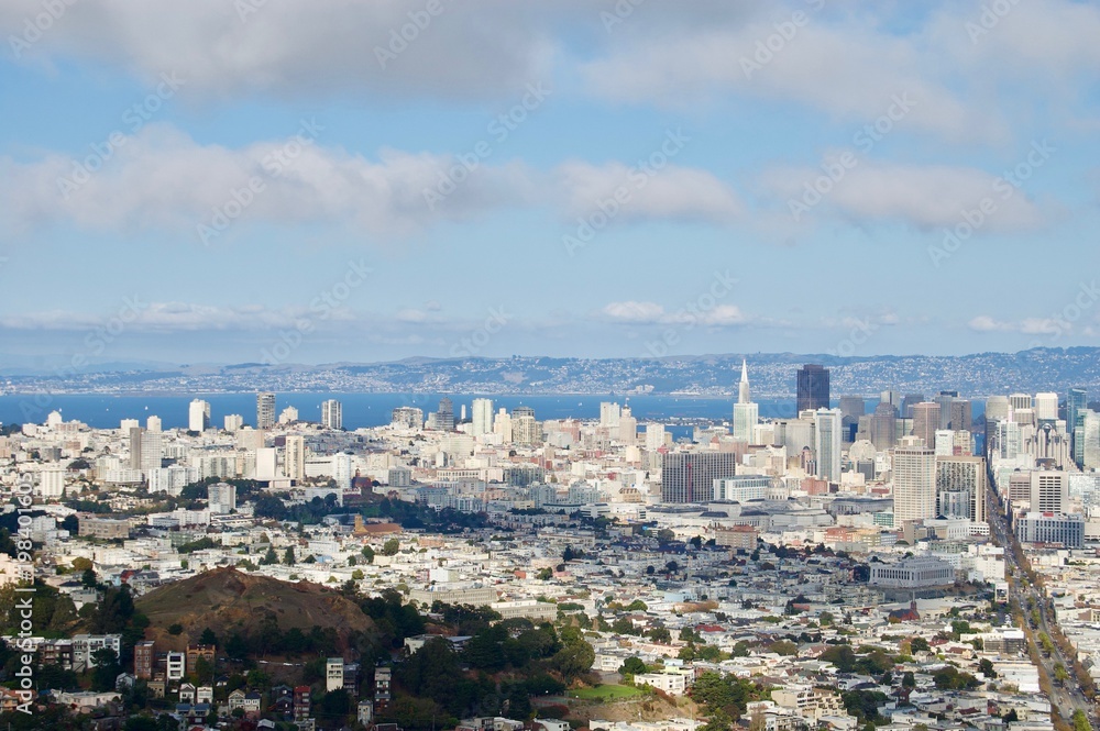 Beautiful aerial view from the San Francisco Twin Peaks overlooking the city's scenic skyline with numerous buildings and landmarks in the background - California, USA