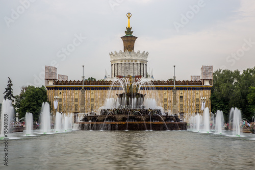 Beautiful fountains on background of pavilion in VDNKH exhibition park in Moscow 