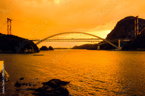 Amakusa Gobashi (No. 1 Bridge) scenery against the backdrop of the sunset sky 