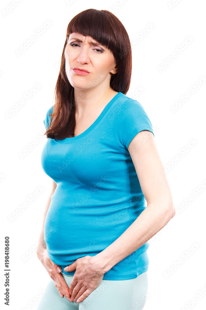 Pregnant woman with hands on her stomach, pregnancy health care and bladder aches Pregnant woman with hands on her stomach, pregnancy health care and bladder aches