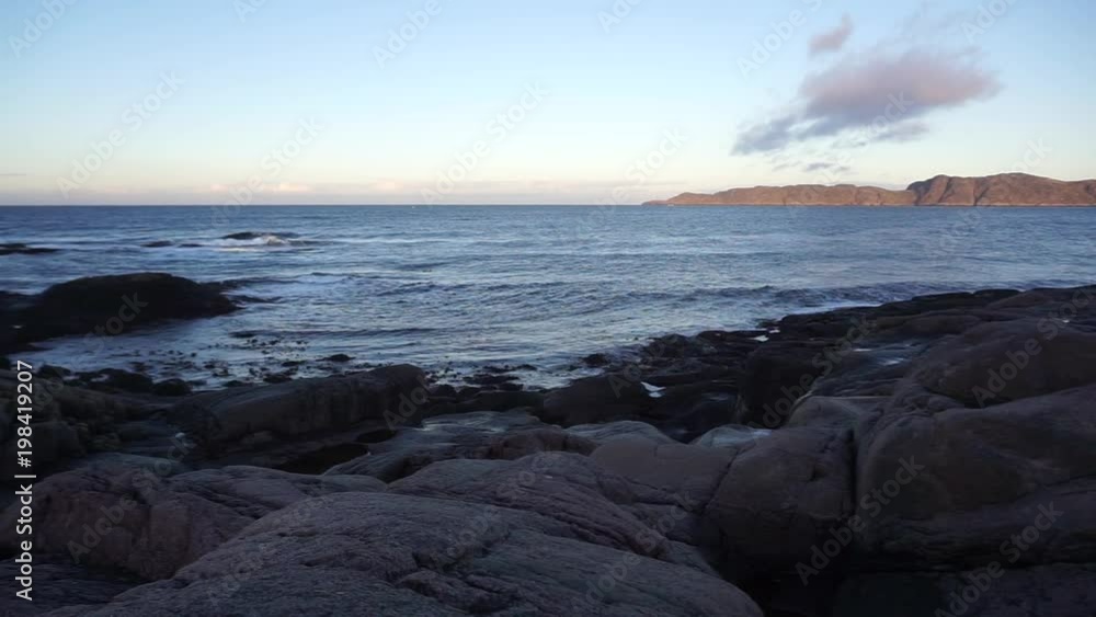 Beautiful landscape of round shape rocks beach with Barents Sea at the arctic coast background in Terriberka, Russia Beautiful landscape of round shape rocks beach with Barents Sea at the arctic coast background in Terriberka, Russia