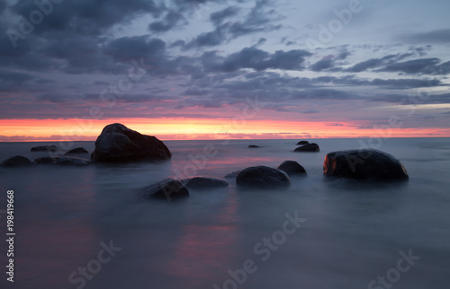 Sunset from the beach of a national park in sweden photographed with long exposure