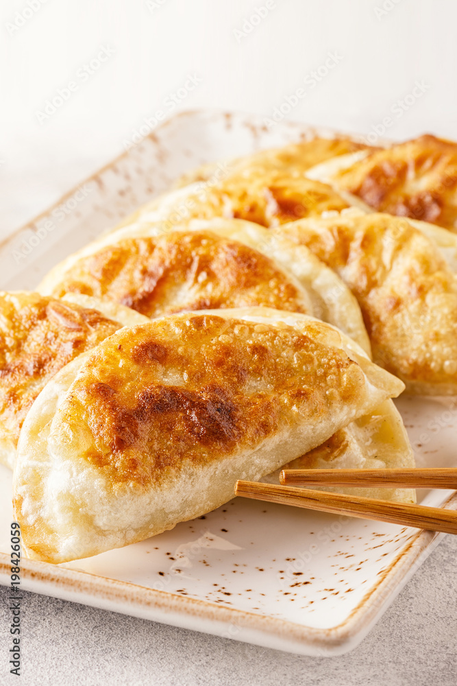 Plate of asian gyoza, dumplings snack.