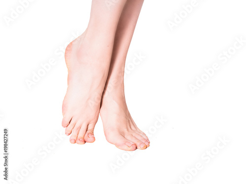 Fototapeta Naklejka Na Ścianę i Meble -  Beautiful well-groomed female a foot and a heel on a white background.