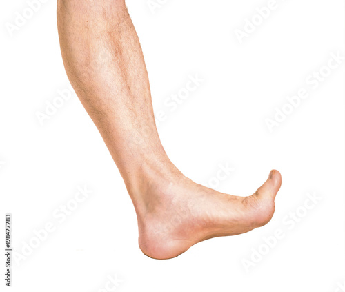 Bare male foot walking. Isolated on white background