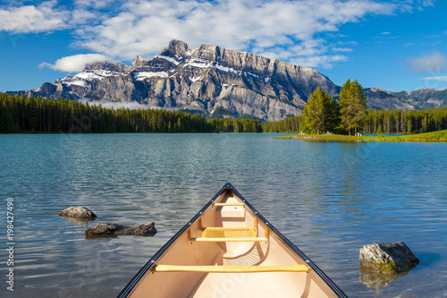 A canoe on the water at Two Jacks Lake in Banff National Park, Alberta, Canada photo