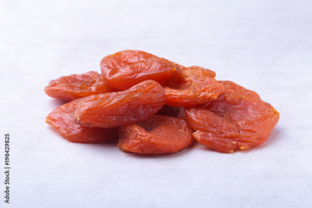 dried apricots isolated white background. selective focus. dried apricots isolated white background. selective focus.