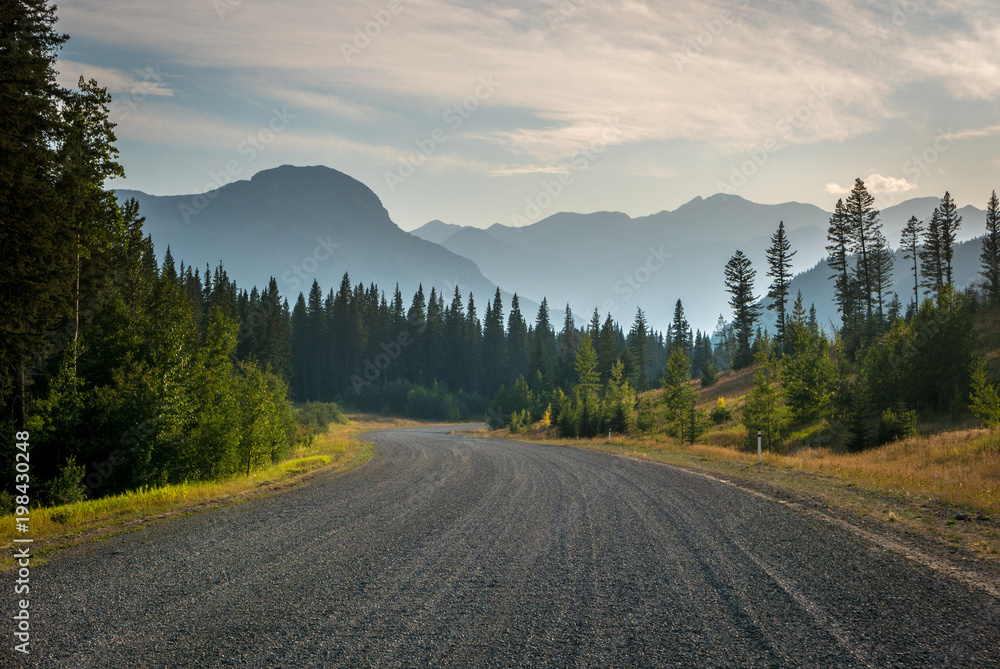 Gravel road in Kananaskis Country, Alberta with haze from forest fires