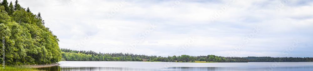 Lake scenery in panorama with calm water Lake scenery in panorama with calm water