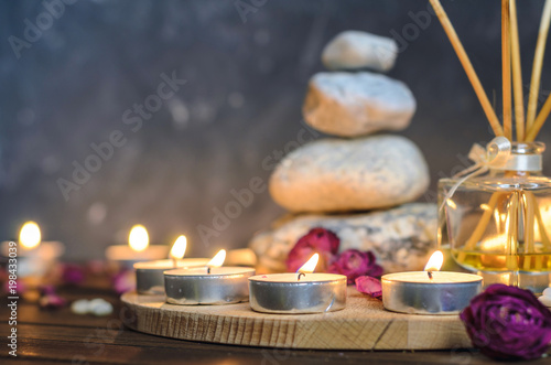 Spa composition-stones, candles, aromatherapy, dry flowers.