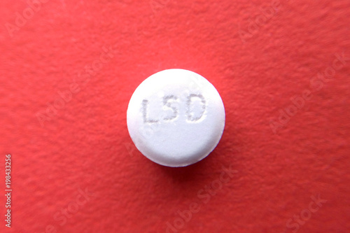 Tablet LSD on red photo