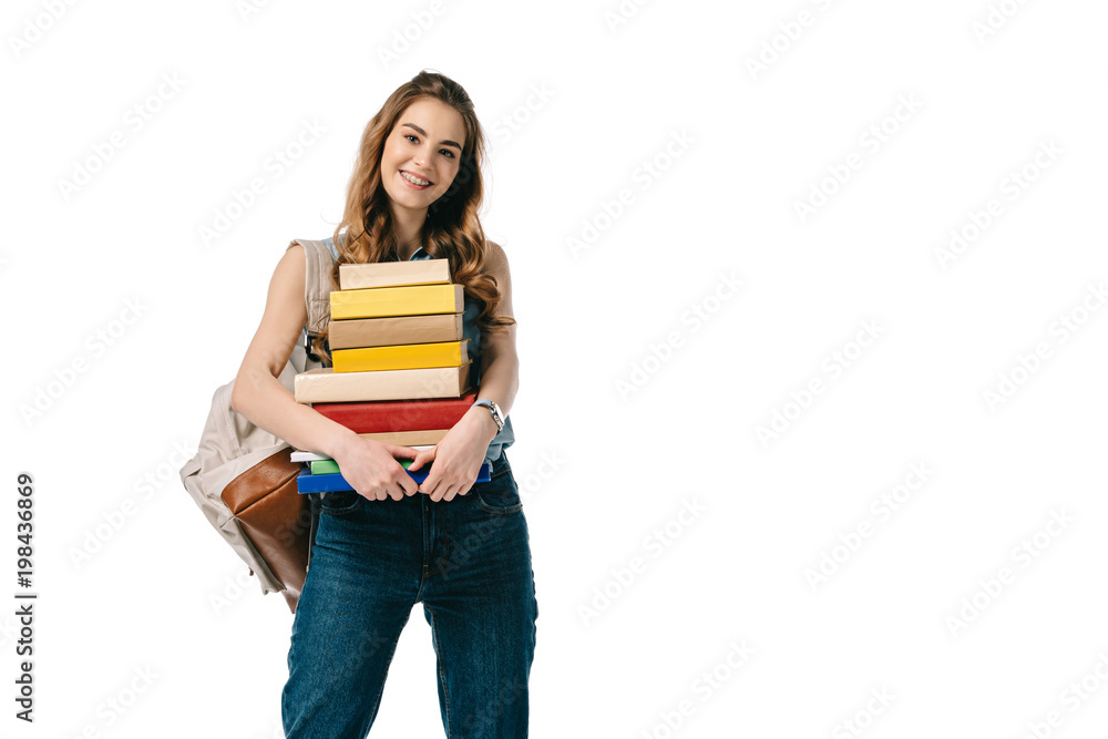 smiling beautiful student holding stack of books isolated on white smiling beautiful student holding stack of books isolated on white