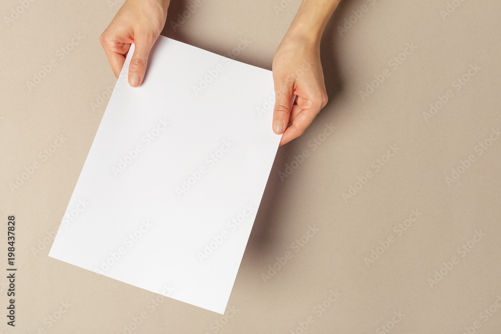 Hand holding papers a4 size Hand holding papers a4 size