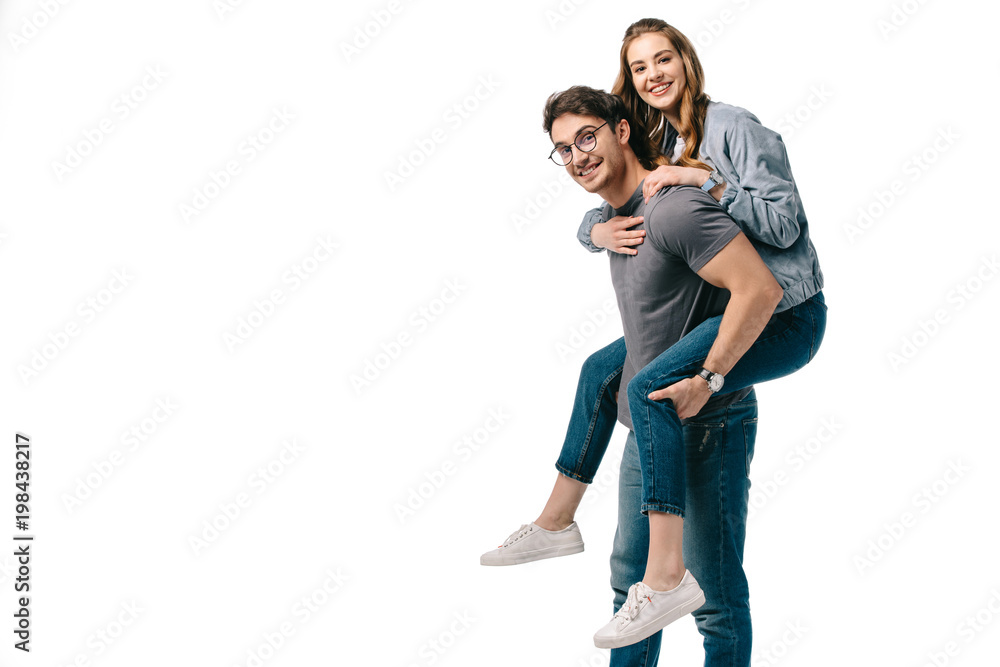 boyfriend giving piggyback to girlfriend and they looking at camera isolated on white boyfriend giving piggyback to girlfriend and they looking at camera isolated on white