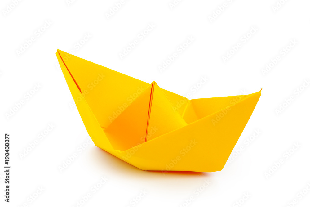 Naklejka premium origami paper boat isolated on white background