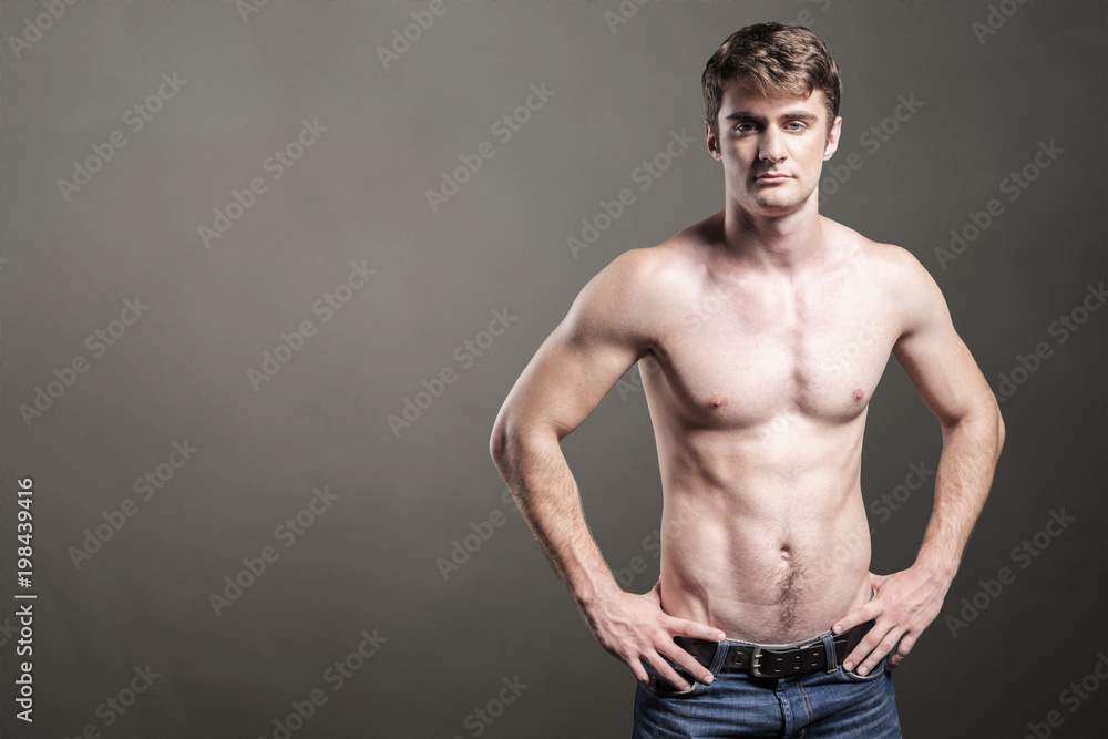 Portrait of a well built shirtless muscular male model