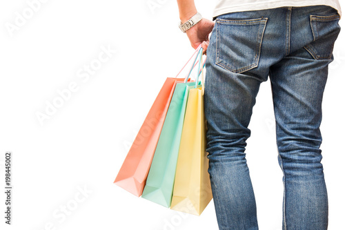 man wear jean and hold colorful fashion shopping bag, buy from shop, in hand on isolated background