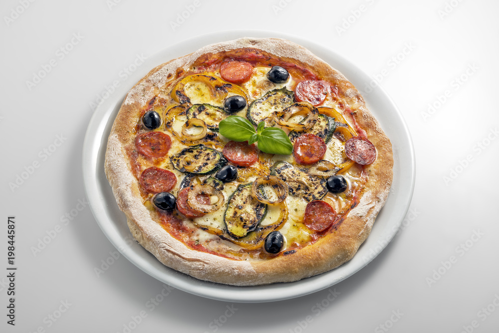 Pizza mozzarella tomato salami and grilled vegetables Pizza mozzarella tomato salami and grilled vegetables