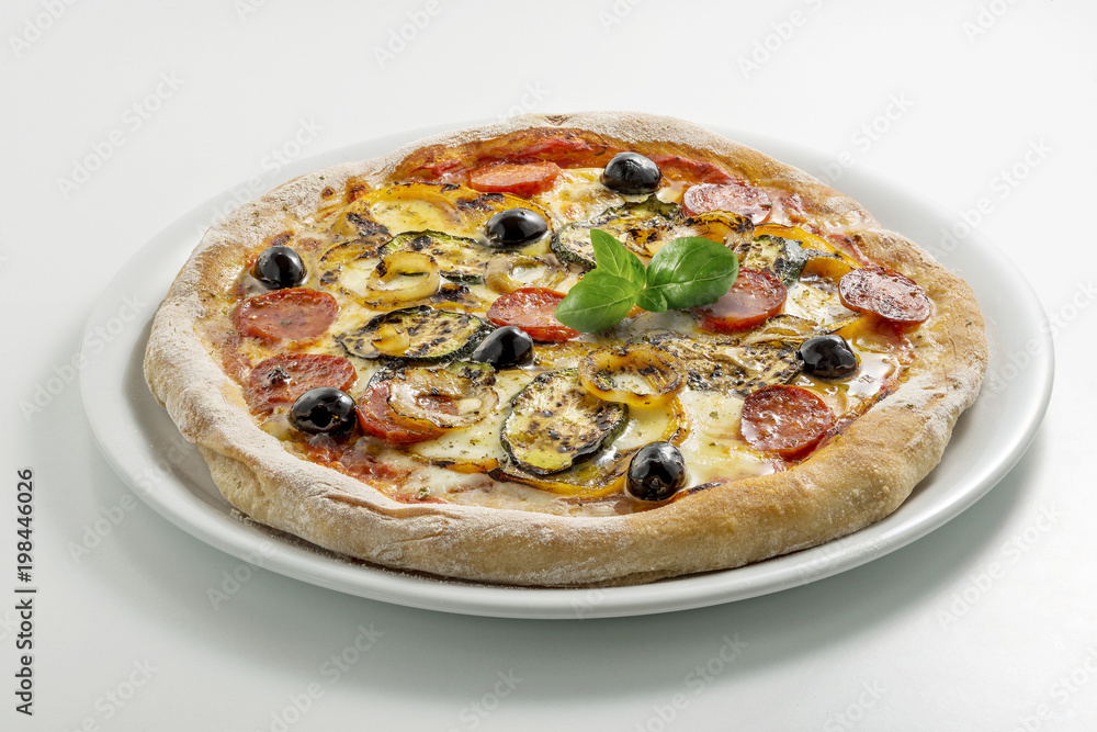 Pizza mozzarella tomato salami and grilled vegetables