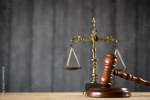 Law theme, mallet of the judge, wooden desk,