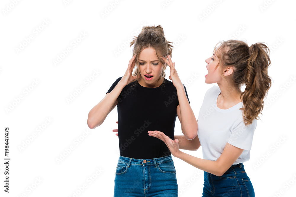 twin screaming at sister isolated on white twin screaming at sister isolated on white