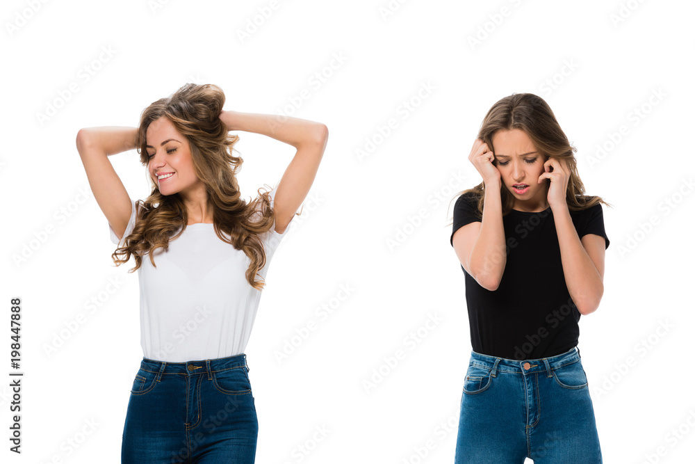 smiling and upset twins standing isolated on white smiling and upset twins standing isolated on white