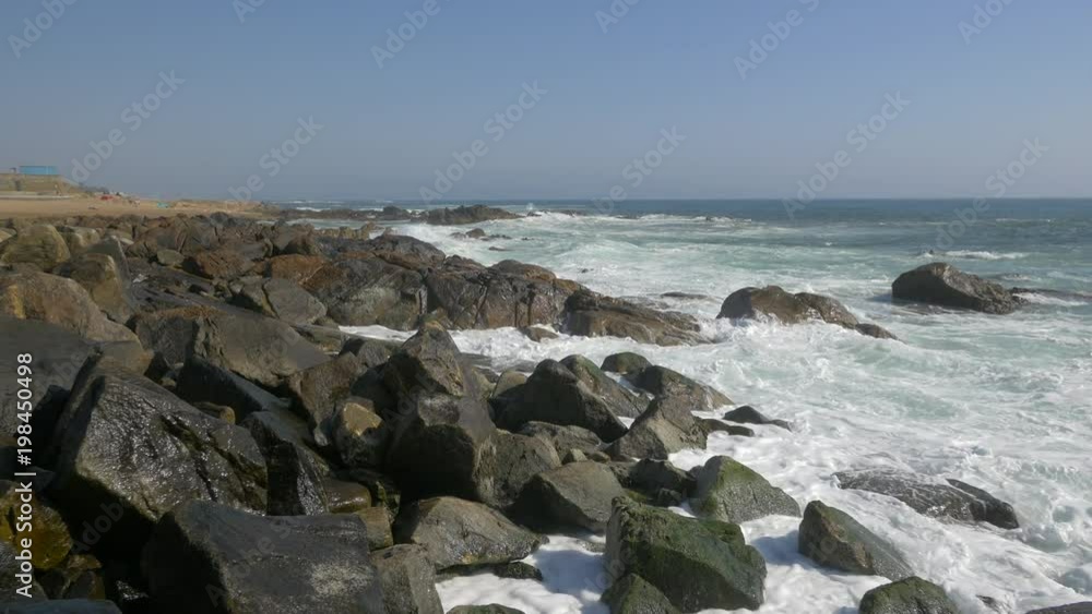 Waves hitting a rocky coastline Waves hitting a rocky coastline