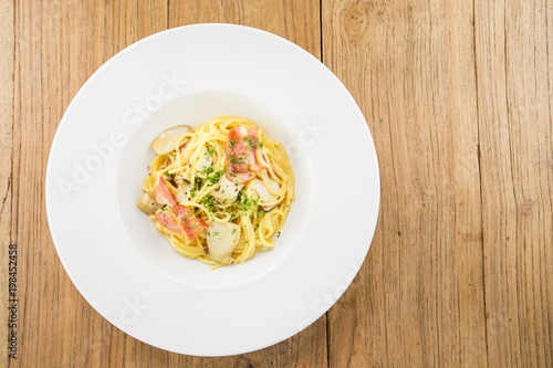 Spaghetti Carbonara.This recipe with Bacon Egg Mushroom Parmesan cheese and Spaghetti.Food styling on table.